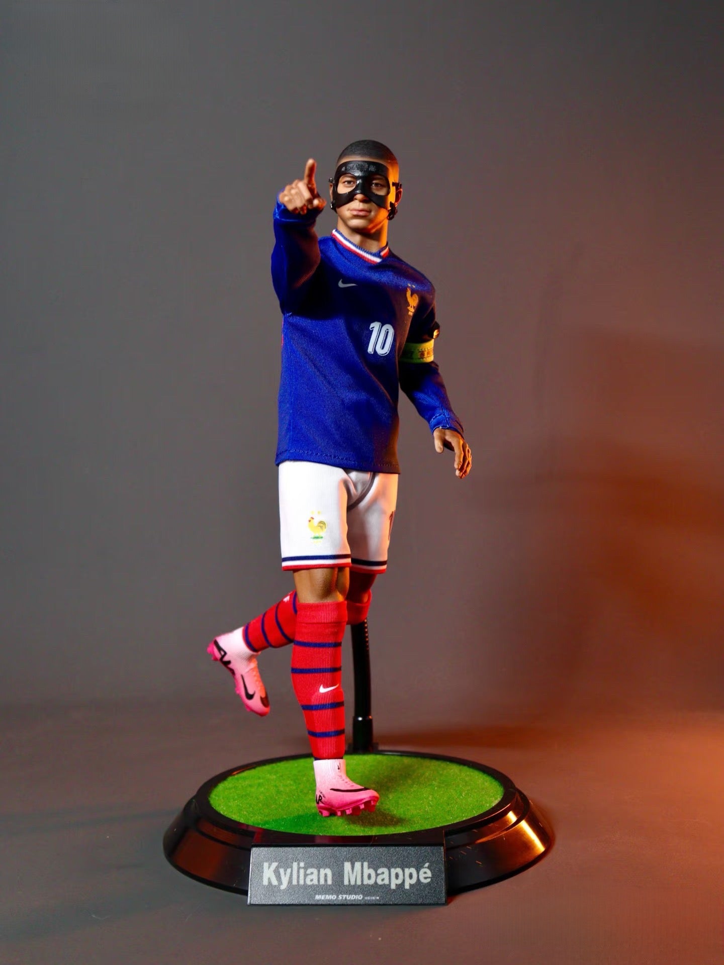Mbappé collectible figure side profile displaying realistic body proportions and outfit details
