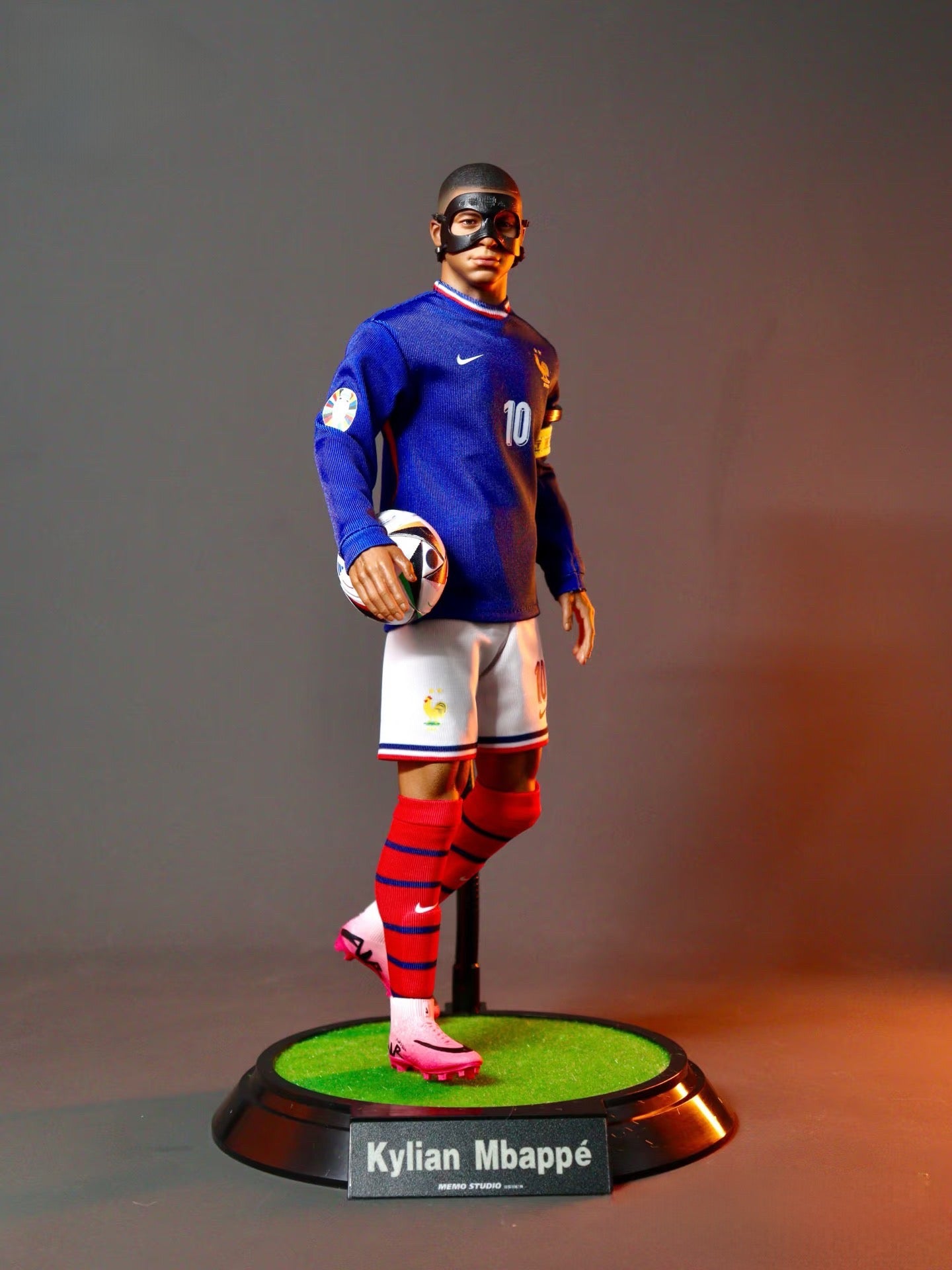 Kylian Mbappé action figure front view showcasing detailed facial expression and PSG jersey